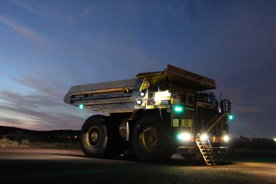 Mining vehicle with lights switched on