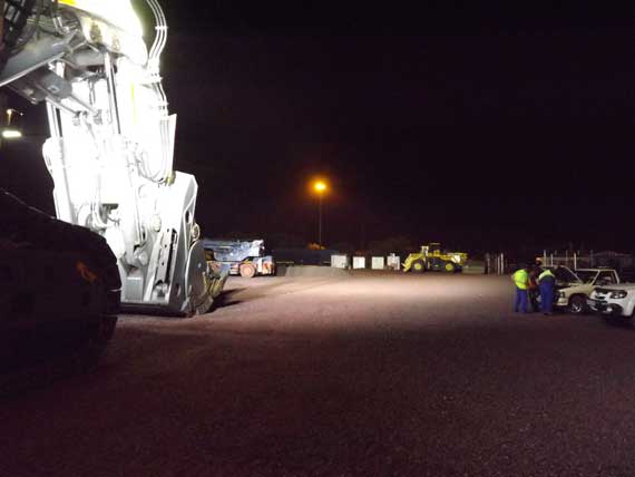 Mining and excavation equipment at night